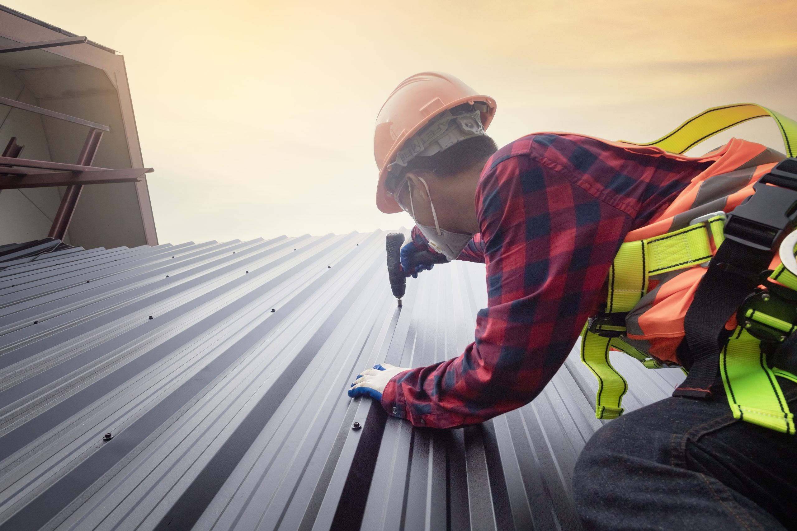 Roofer worker in protective uniform wear and gloves,Roofing too